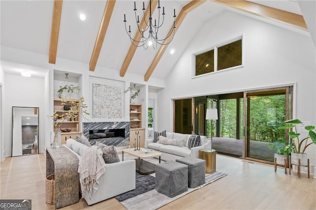 402 Chattahoochee St, Roswell, GA 30075 - living room with high vaulted ceiling, beamed ceiling, a chandelier, built in shelves, and recessed lighting