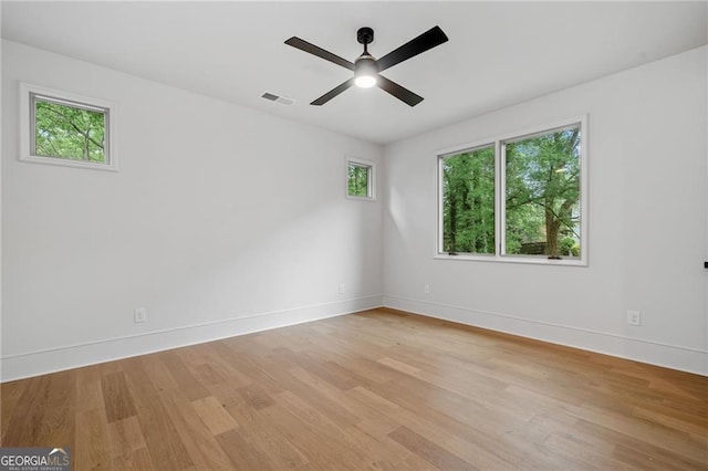 402 Chattahoochee St, Roswell, GA 30075 - empty room with light wood finished floors and ceiling fan
