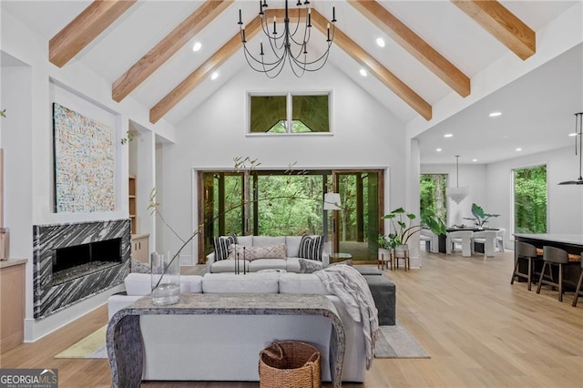 402 Chattahoochee St, Roswell, GA 30075 - living room with high vaulted ceiling, beamed ceiling, recessed lighting, a fireplace, and light wood finished floors