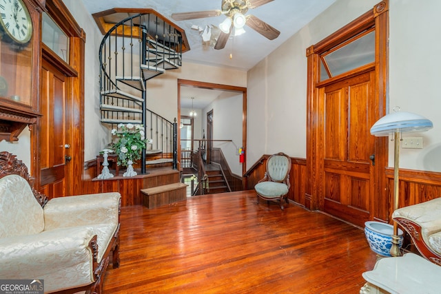 622 Main St, Blackshear, GA 31516 - living room with a ceiling fan, wood finished floors, stairway, and wainscoting