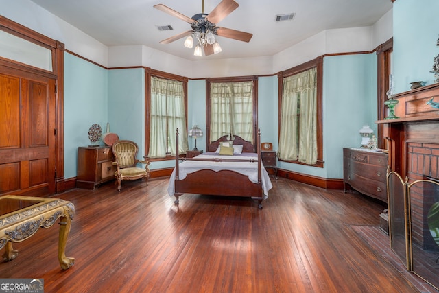 622 Main St, Blackshear, GA 31516 - bedroom with wood-type flooring, a ceiling fan, baseboards, and visible vents