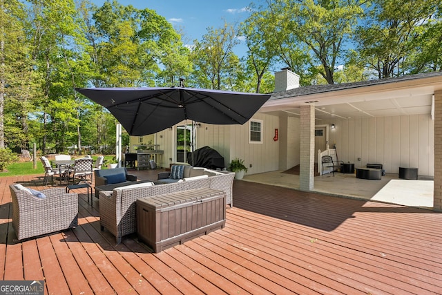 wooden terrace featuring outdoor dining area
