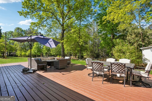 deck featuring an outdoor hangout area and outdoor dining area