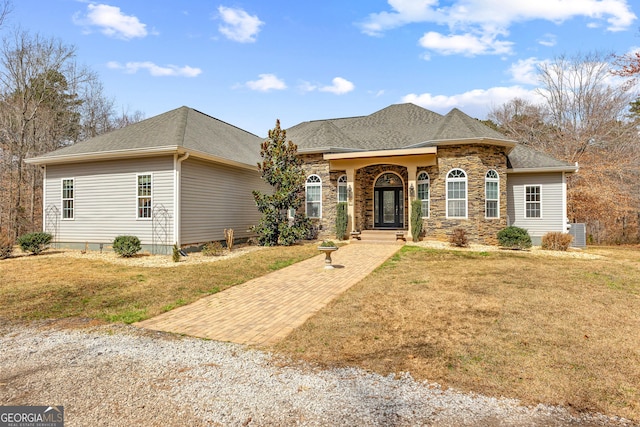 1452 Redwine Rd, Fayetteville, GA 30215 - view of front of house featuring a front yard, stone siding, and roof with shingles