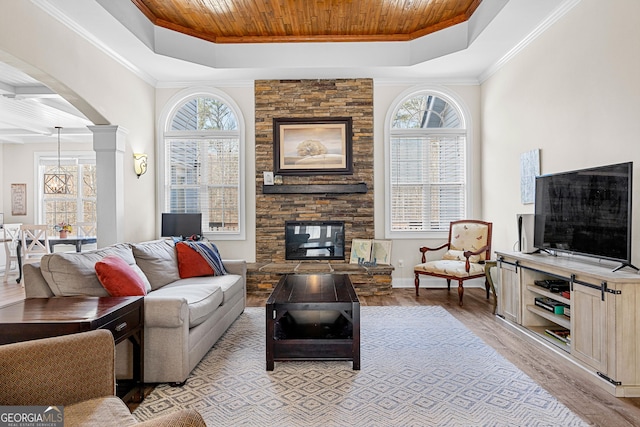 1452 Redwine Rd, Fayetteville, GA 30215 - living area featuring wood ceiling, a raised ceiling, healthy amount of natural light, arched walkways, and light wood-style floors