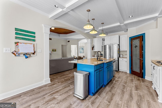 1452 Redwine Rd, Fayetteville, GA 30215 - kitchen featuring blue cabinets, white cabinetry, decorative columns, light wood-type flooring, and coffered ceiling