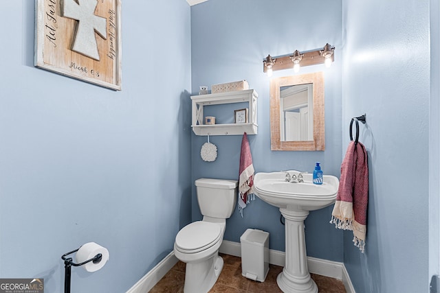 1452 Redwine Rd, Fayetteville, GA 30215 - half bathroom featuring toilet and tile patterned flooring