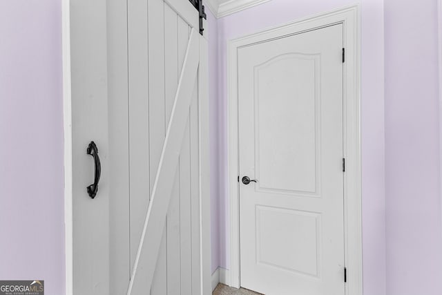 1452 Redwine Rd, Fayetteville, GA 30215 - detailed view of a barn door and crown molding