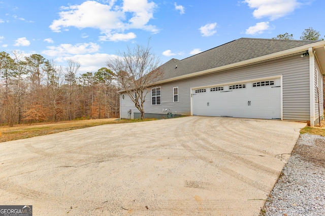 1452 Redwine Rd, Fayetteville, GA 30215 - view of home's exterior with driveway and a garage