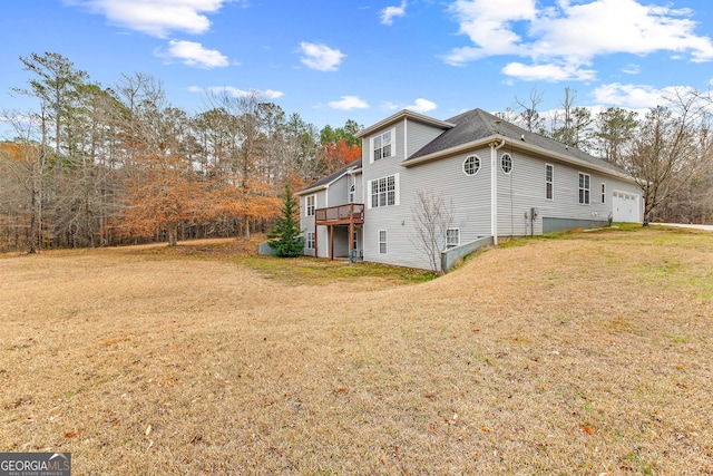 1452 Redwine Rd, Fayetteville, GA 30215 - view of home's exterior featuring a lawn, a wooden deck, and a garage