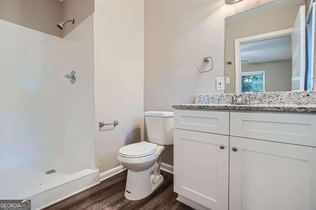 2184 Pemberton Rd SW, Atlanta, GA 30331 - bathroom featuring wood finished floors, a shower, and vanity