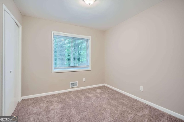 2184 Pemberton Rd SW, Atlanta, GA 30331 - unfurnished bedroom with carpet and a closet