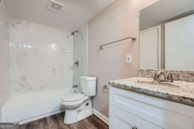 2184 Pemberton Rd SW, Atlanta, GA 30331 - bathroom featuring wood finished floors, a textured ceiling, vanity, and  shower combination