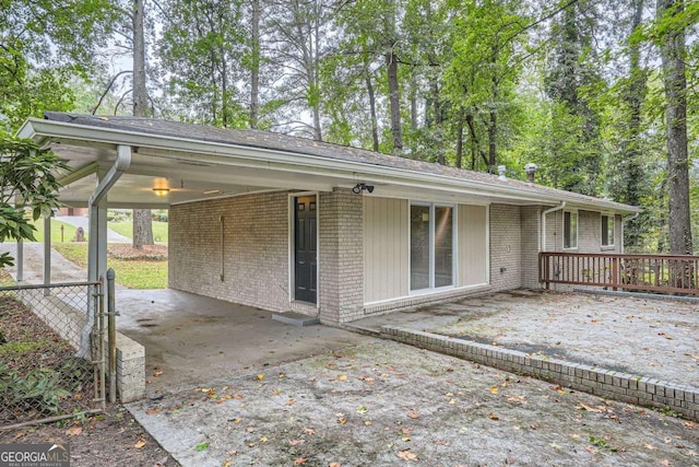 2184 Pemberton Rd SW, Atlanta, GA 30331 - rear view of property with brick siding and a carport