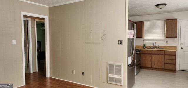 full bathroom featuring marble finish floor, toilet, washtub / shower combination, and a textured ceiling