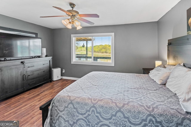 532 Henry Higgins Rd, Jackson, GA 30233 - bedroom with dark wood-type flooring, ceiling fan, and baseboards