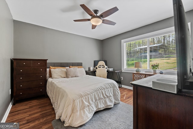 532 Henry Higgins Rd, Jackson, GA 30233 - bedroom featuring wood finished floors, baseboards, an office area, and ceiling fan