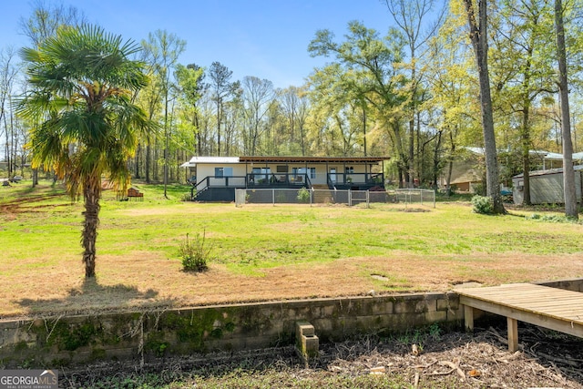 532 Henry Higgins Rd, Jackson, GA 30233 - rear view of property featuring a lawn and a deck