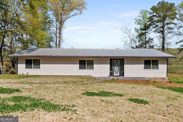 532 Henry Higgins Rd, Jackson, GA 30233 - view of front of house featuring a front yard and metal roof