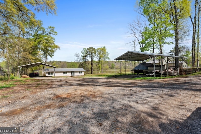 532 Henry Higgins Rd, Jackson, GA 30233 - view of parking / parking lot featuring a detached carport and driveway