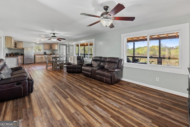 532 Henry Higgins Rd, Jackson, GA 30233 - living room with a ceiling fan, dark wood-type flooring, and baseboards