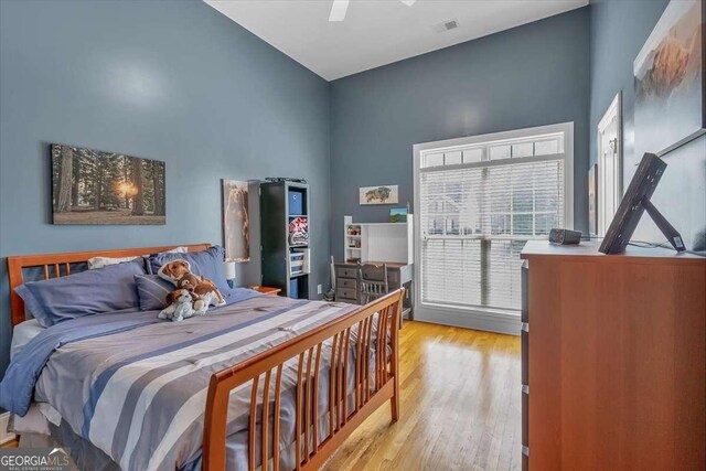 bedroom with wood finished floors and ceiling fan