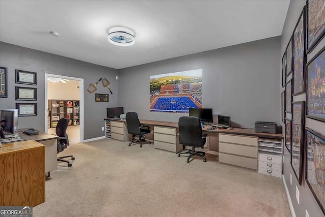 office space with light colored carpet and baseboards