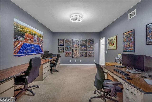 carpeted home office featuring baseboards and visible vents