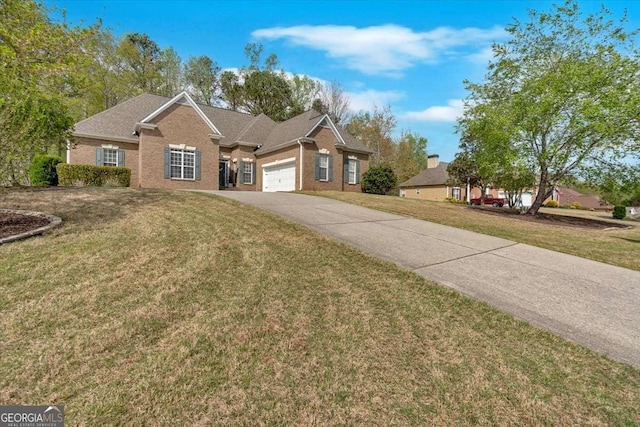 view of front of house with driveway, a front yard, brick siding, a garage, and a shingled roof