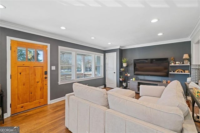living area featuring recessed lighting, wood finished floors, and ornamental molding