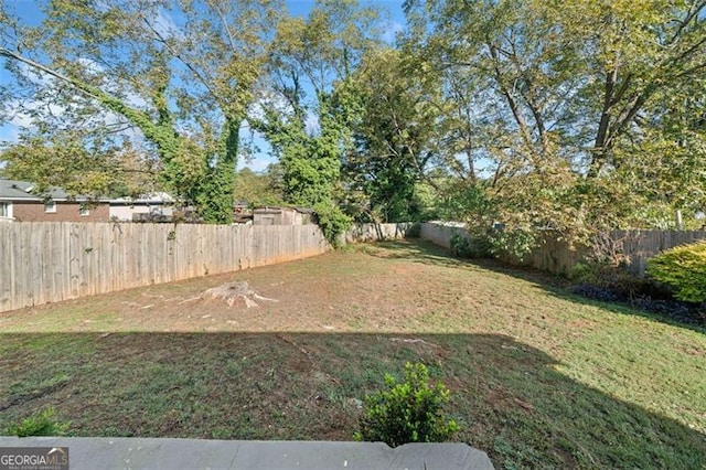 view of yard featuring a fenced backyard
