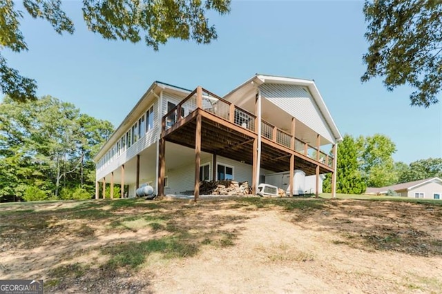 300 Ellis Rd, Rome, GA 30161 - rear view of house with a wooden deck and dirt driveway