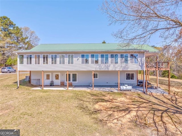 300 Ellis Rd, Rome, GA 30161 - rear view of property featuring a lawn, central AC, and a patio
