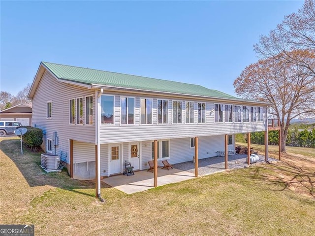 300 Ellis Rd, Rome, GA 30161 - back of house featuring a patio, metal roof, central air condition unit, and a yard