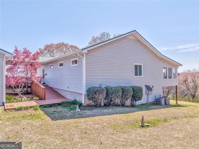300 Ellis Rd, Rome, GA 30161 - view of side of property with a lawn, a wooden deck, and central AC