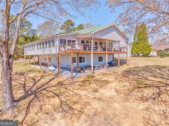 300 Ellis Rd, Rome, GA 30161 - back of property with a deck and a patio area