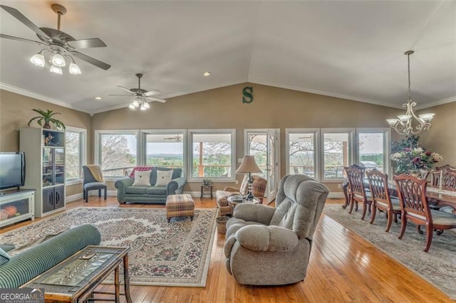 300 Ellis Rd, Rome, GA 30161 - living room featuring crown molding, lofted ceiling, hardwood / wood-style floors, ceiling fan with notable chandelier, and baseboards
