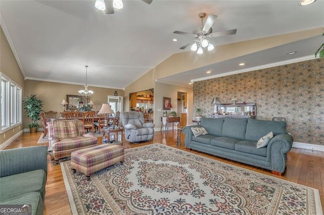 300 Ellis Rd, Rome, GA 30161 - living area featuring crown molding, lofted ceiling, wallpapered walls, and ceiling fan with notable chandelier
