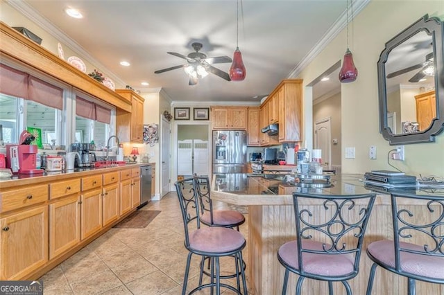 300 Ellis Rd, Rome, GA 30161 - kitchen featuring light tile patterned flooring, a peninsula, a breakfast bar, ceiling fan, and appliances with stainless steel finishes