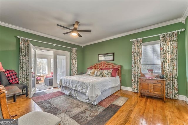 300 Ellis Rd, Rome, GA 30161 - bedroom with baseboards, ornamental molding, hardwood / wood-style flooring, and a ceiling fan