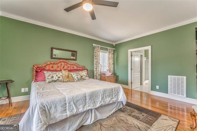300 Ellis Rd, Rome, GA 30161 - bedroom featuring baseboards, visible vents, crown molding, and wood finished floors