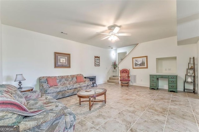 300 Ellis Rd, Rome, GA 30161 - living room featuring a ceiling fan, light tile patterned floors, stairway, and visible vents