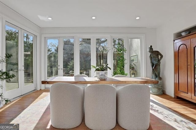 sunroom / solarium with plenty of natural light and french doors
