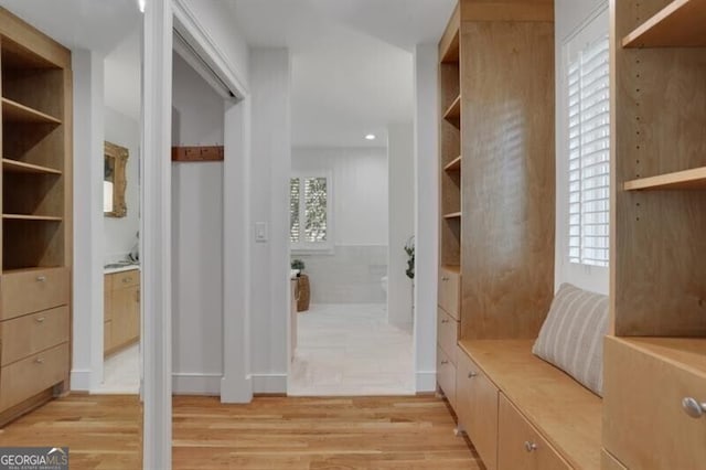 mudroom with light wood finished floors