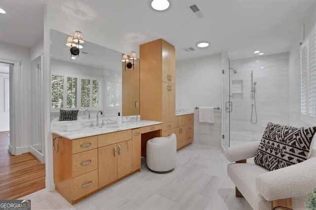 bathroom featuring ceiling fan, a shower stall, vanity, visible vents, and recessed lighting