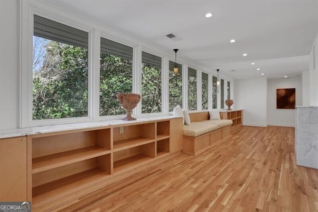 unfurnished sunroom with visible vents