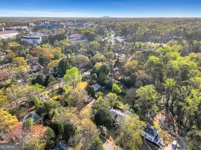 birds eye view of property with a forest view