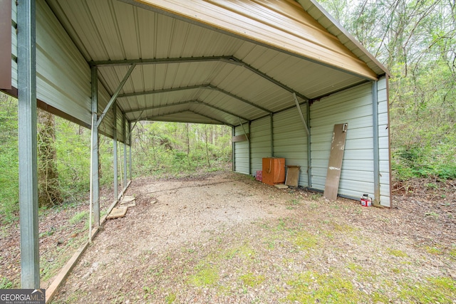 view of vehicle parking with a carport