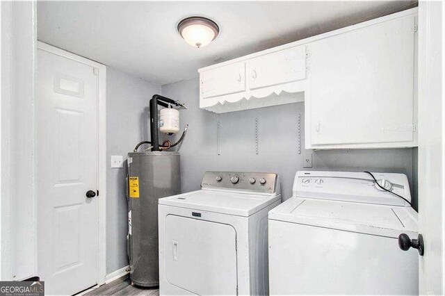 3862 Northstrand Dr, Decatur, GA 30035 - laundry room featuring separate washer and dryer, electric water heater, and cabinet space