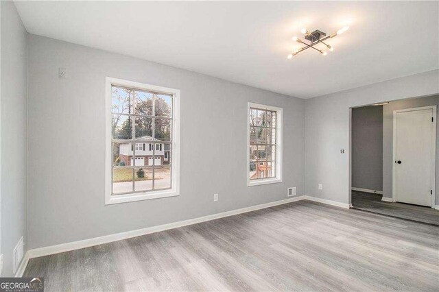 3862 Northstrand Dr, Decatur, GA 30035 - unfurnished room featuring baseboards and wood finished floors
